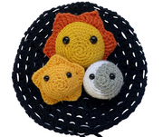 Calming toys for anxiety - crocheted amigurumi sun, moon and star against a black crocheted play mat and carry case