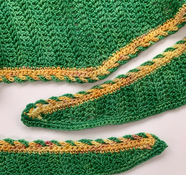 Easy crochet shawl pattern - detail of crocheted shawl border made from green and orange-cream yarn